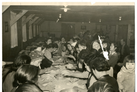 Photograph of making mochi in a mess hall at Manzanar (ddr-csujad-47-77)