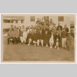 Group photo in front of medical facility with signatures on the back (ddr-densho-515-2)