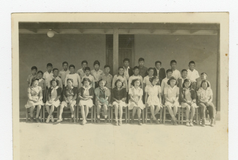 Group of Nisei 7th graders outside a barrack (ddr-csujad-44-30)
