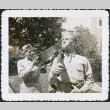 Man pretending to saw gun held by another man (ddr-densho-434-459)