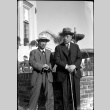 Tomoyuki Nozawa and unknown man standing by fountain (ddr-densho-426-1727)