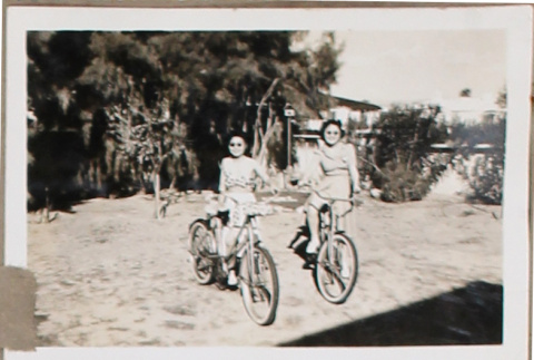 Two women on bicycles (ddr-densho-493-118)