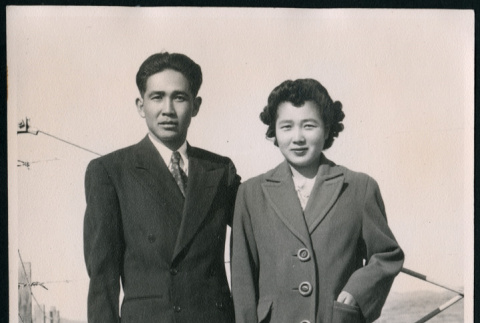Japanese American man and woman stand together (ddr-densho-362-51)