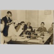 A group of men wearing headphones at a table (ddr-njpa-2-861)