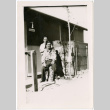 Two men outside barracks (ddr-densho-329-1331)