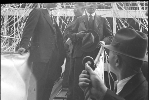 Men coming down gangplank from ship (ddr-densho-426-1620)