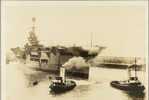 Tugboats pulling the Ark Royal into a harbor (ddr-njpa-13-493)