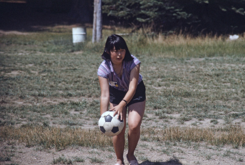 A camper playing kickball with a soccer ball (ddr-densho-336-1580)