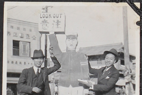Two men with street sign (ddr-densho-326-111)