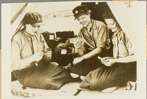 Auxiliary Territorial Service members playing a card game (ddr-njpa-13-230)