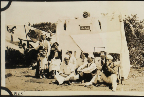 Group at picnic, with tent in background (ddr-densho-423-511)