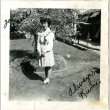 Signed photograph of a woman standing in a garden (ddr-manz-6-39)