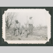 Two men using tools in a field (ddr-densho-471-190)