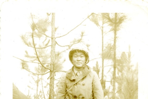 Soldier standing near a tent (ddr-densho-22-202)