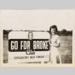 Woman standing by sign for Go For Broke Club, American Red Cross (ddr-densho-466-408)