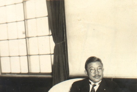 A man seated at a desk (ddr-njpa-4-89)