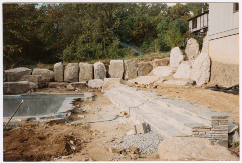 Pool with rock feature under construction (ddr-densho-377-2393)