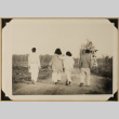 Four walking on a path (ddr-densho-542-587)