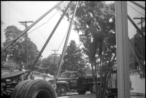 Man standing by truck planting a tree (ddr-densho-377-1547)