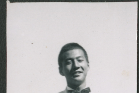Young man in suit with bowtie (ddr-densho-523-267)
