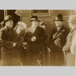 Men standing in a train station (ddr-njpa-1-1868)