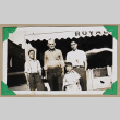 Three men and a boy stand outside the Royal Cafe (ddr-densho-404-360)
