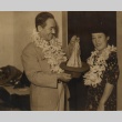 Man holding a hat, posing with a woman (ddr-njpa-4-242)