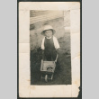 Child pushing a wheelbarrow (ddr-densho-433-789)