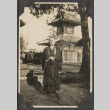 Priest standing in front of a temple (ddr-densho-432-106)