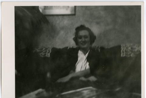 Woman seated on couch (ddr-densho-329-735)