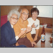 Agnes and Chester Sakura with another woman drinking (ddr-densho-523-574)