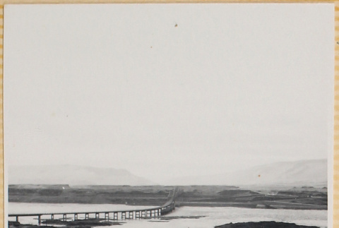 View of dam with roadway in foreground (ddr-densho-522-121)