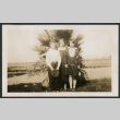 Kids in front of palm (ddr-densho-378-317)