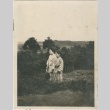 Two women standing in a field (ddr-densho-296-136)