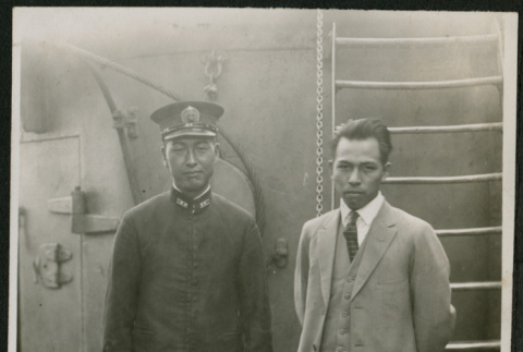 Two men aboard a ship (ddr-densho-359-1080)