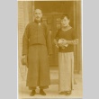 A man and woman standing in a doorway (ddr-njpa-1-1720)