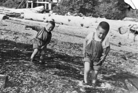 Two children playing on the beach (ddr-densho-20-8)