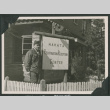 Nisei soldier poses by Repatriation Reception sign (ddr-densho-397-338)