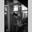 Tomoye (Nozawa) Takahashi in waiting room of station (ddr-densho-426-2345)