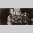 Man and woman standing by desk (ddr-densho-426-1346)