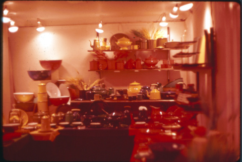Display of enamel and lacquerware kitchen products (ddr-densho-426-325)