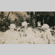 Three ladies and three children sitting in forested area (ddr-densho-348-80)