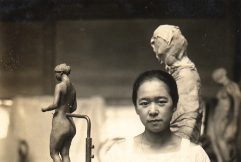 A sculptor posing in her workshop (ddr-njpa-4-1906)