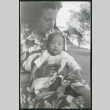 Photograph of Irene Gavigan holding a newborn (ddr-csujad-47-225)