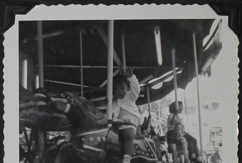 Children on a carousel (ddr-densho-300-431)