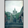 Tomoye Takahashi standing in front of Oura Church, Nagasaki (ddr-densho-426-495)
