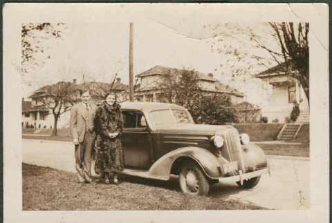 Couple standing by car (ddr-densho-316-316)