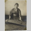 Japanese American woman with koto (ddr-densho-242-30)