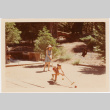 Tomoye Takahashi and young boy playing croquet (ddr-densho-426-1106)