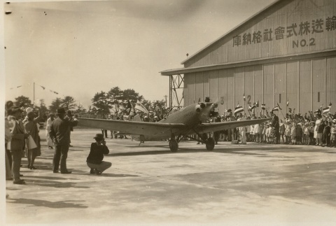 A plane being welcomed to an airfield (ddr-njpa-1-2218)